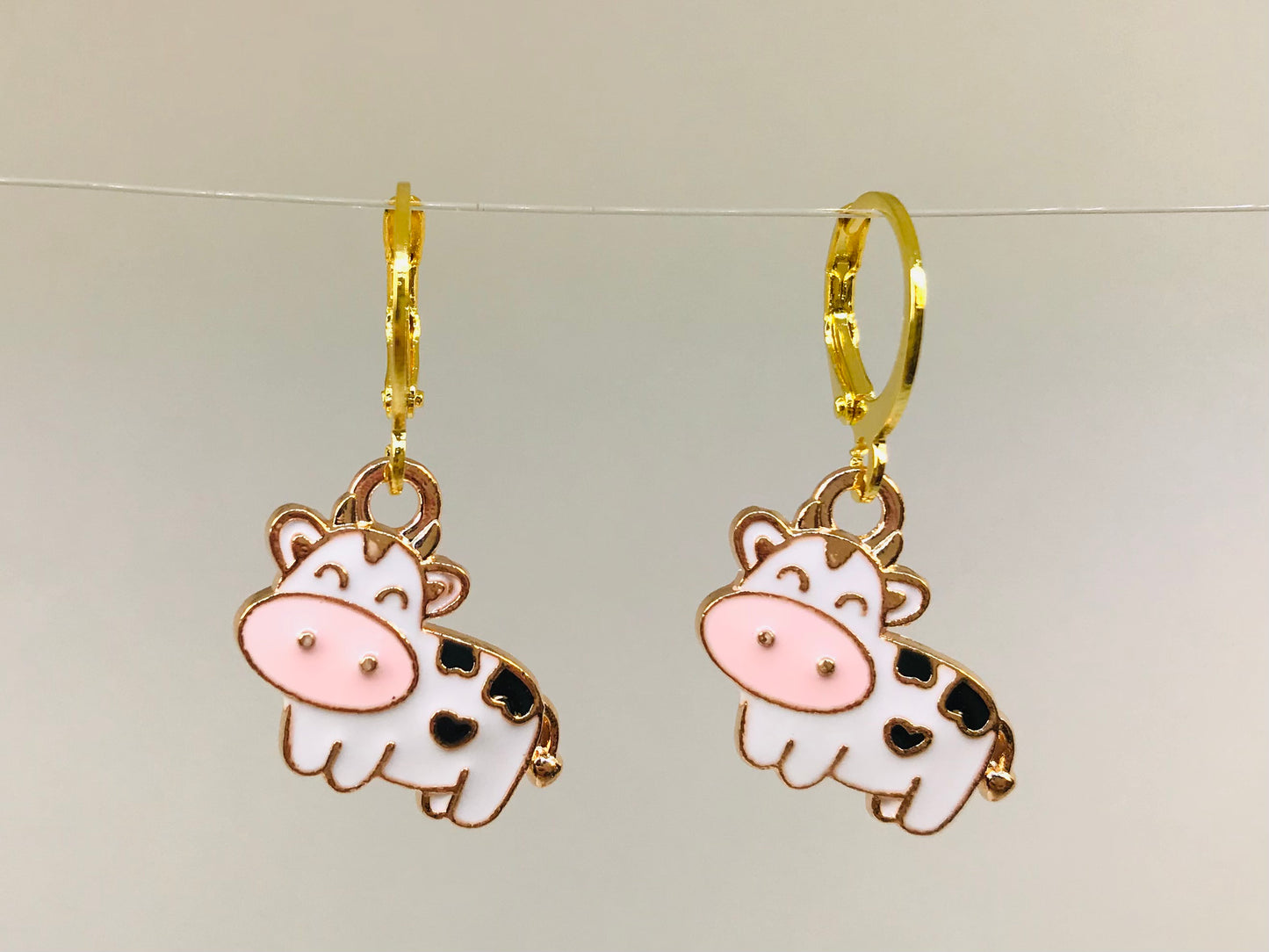 2 Kawaii  Anime cartoon Cow Earrings , enamel huggie earrings